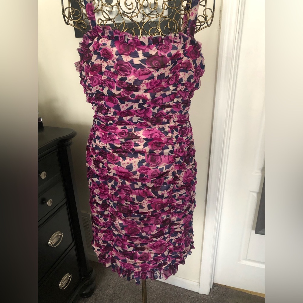 Cute dress with ruching throughout. Great for date night or an evening out.